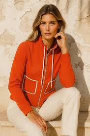 Haut Orly 261169 : tangerine vibrant avec détails contrastés blancs, poches plaquées, manches longues. Parfait pour bureau et sorties. Style audacieux.