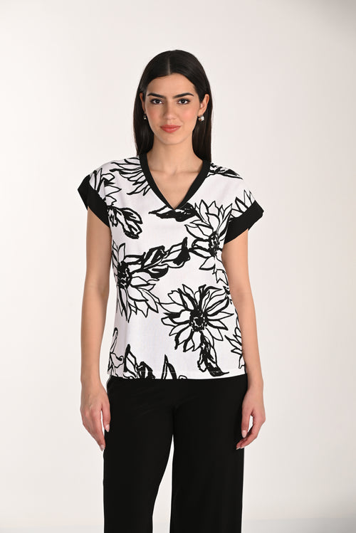 Top Floral Graphique Frank Lyman (266140) — pour la femme qui aime le contraste, qui enfile ce haut sur un pantalon noir et qui laisse l’imprimé faire toute la conversation