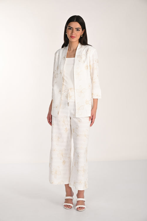 Pantalon Wide-Leg Brodé Ivoire Frank Lyman (266318) — pour la femme qui porte la lumière sur elle, qui l’enfile avec un blazer coordonné et qui choisit l’ivoire quand elle veut être radieuse sans effort