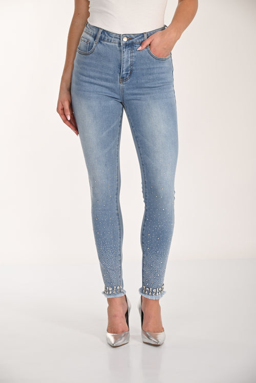 266528 Frank Lyman | Jean skinny bleu avec strass et ourlet effiloché – Style moderne et touche glamour