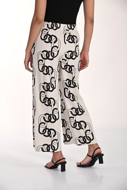 Pantalon blanc et noir à imprimé graphique Frank Lyman 266212 – Style moderne et élégance contrasée pour la femme contemporaine, du bureau aux sorties chic