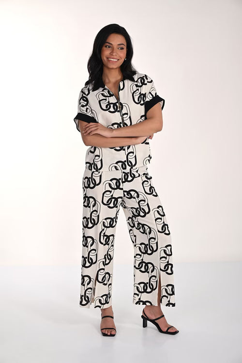 Pantalon blanc et noir à imprimé graphique Frank Lyman 266212 – Style moderne et élégance contrasée pour la femme contemporaine, du bureau aux sorties chic